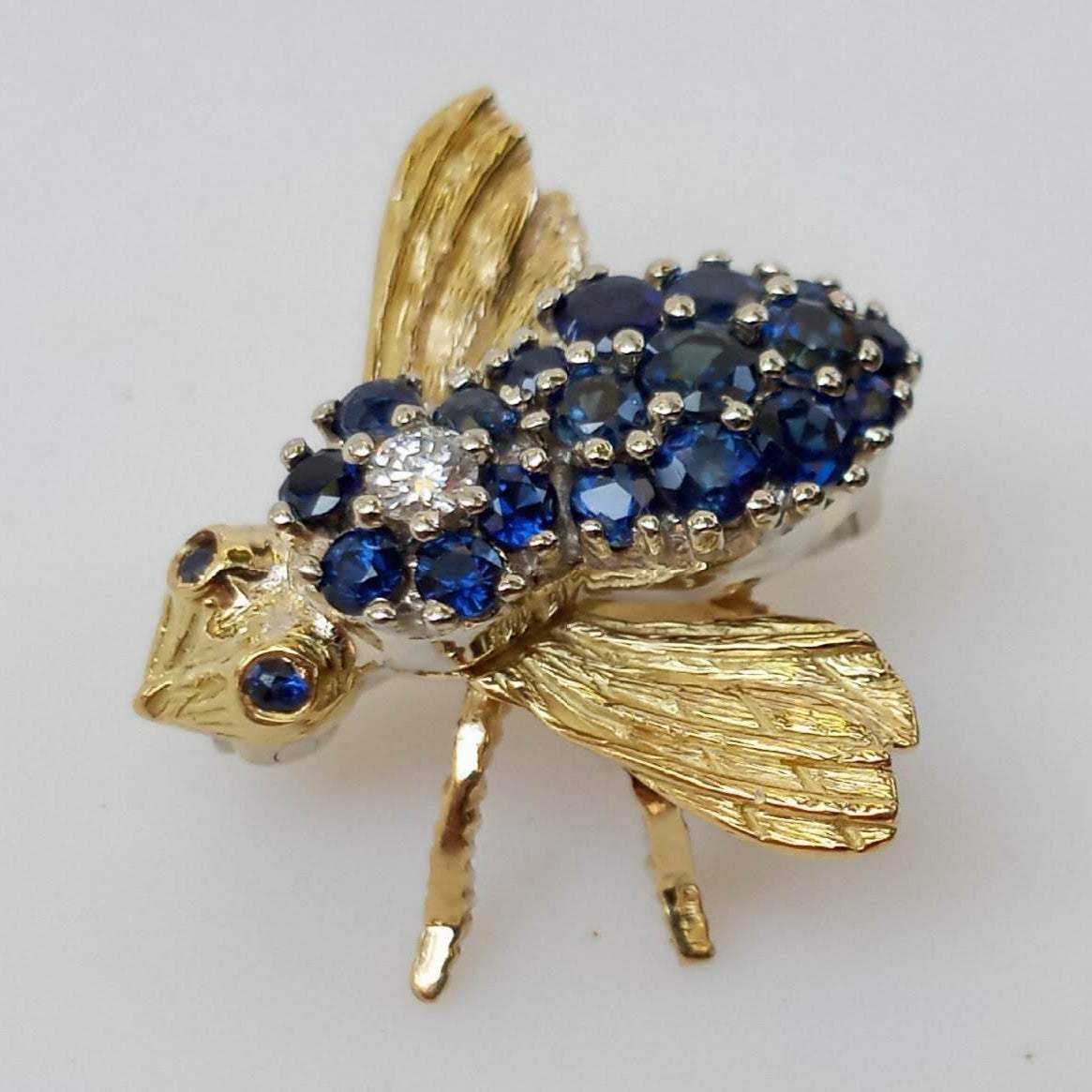 Sapphire and Diamond Bee Brooch, set in 18 karat yellow and white gold.  Beautiful insect jewelry!