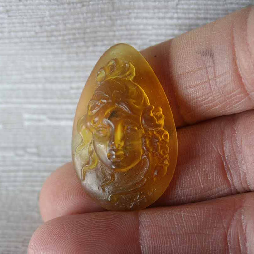Dominican Amber Cameo Carving in Pear shape
